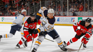 NEWARK, NJ - MARCH 25: Jeff Skinner #53 of the Buffalo Sabres skates with the puck during the third period against Drew Stafford #18 and Damon Severson #28 of the New Jersey Devils at Prudential Center on March 25, 2019 in Newark, New Jersey. (Photo by Jim McIsaac/Getty Images)