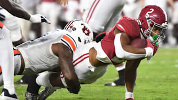 Auburn footballNov 26, 2022; Tuscaloosa, Alabama, USA; Auburn Tigers linebacker Owen Pappoe (0) tackles Alabama Crimson Tide running back Jase McClellan (2) at Bryant-Denny Stadium. Alabama won 49-27. Mandatory Credit: Gary Cosby Jr.-USA TODAY Sports