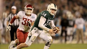 SAN DIEGO, CA - DECEMBER 28: Nnamdi Oguayo #30 of the Washington State Cougars pressures Brian Lewerke #14 of the Michigan State Spartans from the pocket during the second half of the SDCCU Holiday Bowl at SDCCU Stadium on December 28, 2017 in San Diego, California. (Photo by Sean M. Haffey/Getty Images)
