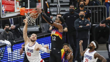 PHOENIX, ARIZONA - JUNE 22: Deandre Ayton #22 of the Phoenix Suns dunks the ball over Ivica Zubac #40 of the LA Clippers during the fourth quarter in game two of the NBA Western Conference finals in-which the Phoenix Suns defeated the LA Clippers 104-103 at Phoenix Suns Arena on June 22, 2021 in Phoenix, Arizona. NOTE TO USER: User expressly acknowledges and agrees that, by downloading and or using this photograph, User is consenting to the terms and conditions of the Getty Images License Agreement. (Photo by Christian Petersen/Getty Images)
