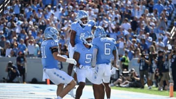 Sep 16, 2023; Chapel Hill, North Carolina, USA; North Carolina Tar Heels wide receiver Nate McCollum (6) celebrates with teammates after scoring a touchdown in the first quarter at Kenan Memorial Stadium. Mandatory Credit: Bob Donnan-USA TODAY Sports