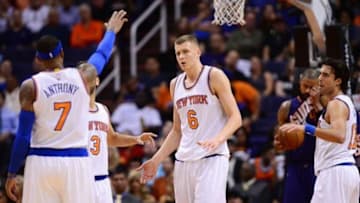 Mar 9, 2016; Phoenix, AZ, USA; New York Knicks forward Kristaps Porzingis (6) celebrates with teammates after scoring in the second half against the Phoenix Suns at Talking Stick Resort Arena. Mandatory Credit: Jennifer Stewart-USA TODAY Sports