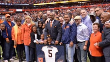 Nov 2, 2013; Syracuse, NY, USA; Syracuse Orange former quarterback Donovan McNabb with family and friends after having his jersey retired during halftime of a game against the Wake Forest Demon Deacons at the Carrier Dome. Mandatory Credit: Mark Konezny-USA TODAY Sports