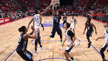 LAS VEGAS, NV - JULY 14: Jevon Carter #3 of the Memphis Grizzlies goes to the basket against the Utah Jazz during the 2018 Las Vegas Summer League on July 14, 2018 at the Thomas & Mack Center in Las Vegas, Nevada. NOTE TO USER: User expressly acknowledges and agrees that, by downloading and/or using this photograph, user is consenting to the terms and conditions of the Getty Images License Agreement. Mandatory Copyright Notice: Copyright 2018 NBAE (Photo by Garrett Ellwood/NBAE via Getty Images)