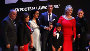 LONDON, ENGLAND - OCTOBER 23: Cristiano Ronaldo of Portugal and Real Madrid CF wins The best Fifa men's player and celebrates on stage with Georgina Rodriguez and Cristiano Ronaldo Junior during The Best FIFA Football Awards Show on October 23, 2017 in London, England. (Photo by Michael Steele/Getty Images)