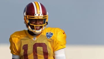 Aug 10, 2014; Richmond, VA, USA; Washington Redskins quarterback Robert Griffin III (10) stands on the field during practice on day eighteen of training camp at Bon Secours Washington Redskins Training Center. Mandatory Credit: Geoff Burke-USA TODAY Sports
