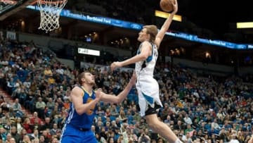 Feb 24, 2013; Minneapolis, MN, USA; Minnesota Timberwolves small forward Andrei Kirilenko (47) dunks against Golden State Warriors power forward David Lee (10) in the fourth quarter at Target Center. The Warriors won 100-99. Mandatory Credit: Greg Smith-USA TODAY Sports