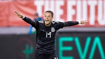 EAST RUTHERFORD, NJ - SEPTEMBER 06: Javier Hernandez #14 of Mexico throws his arms out as he celebrates the goal by Erick Gutierrez #25 of Mexico during the 2nd half of the Friendly match between the United States Men's National Team and Mexico. The match was held at MetLife Stadium on September 06, 2019 in East Rutherford, NJ USA. Mexico won the match with a score of 3 to 0. (Photo by Ira L. Black/Corbis via Getty Images)