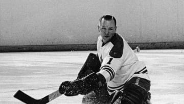 Canadian hockey player Johnny Bower, goalkeeper for the Toronto Maple Leafs, goes to the ice as he watches the puck, 1960s. (Photo by Pictorial Parade/Hulton Archive/Getty Images)
