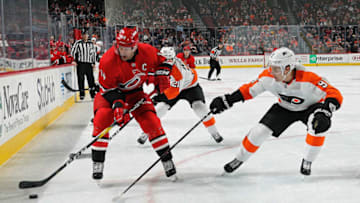PHILADELPHIA, PA - JANUARY 03: Justin Williams #14 of the Carolina Hurricanes skates the puck against Ivan Provorov #9 of the Philadelphia Flyers on January 3, 2019 at the Wells Fargo Center in Philadelphia, Pennsylvania. (Photo by Len Redkoles/NHLI via Getty Images)