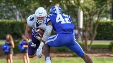 Sep 18, 2021; Durham, North Carolina, USA; Northwestern Wildcats tight end Marshall Lang (88) lowers his shoulder after a catch as Duke Blue Devils linebacker Shaka Heyward (42) squares for the tackle during the second quarter at Wallace Wade Stadium. Mandatory Credit: William Howard-USA TODAY Sports