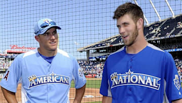 July 9, 2012; Kansas City, MO, USA; American League outfielder Mike Trout (left) of the Los Angeles Angels talks with National League outfielder Bryce Harper (right) of the Washington Nationals during practice for the 2012 All Star Game at Kauffman Stadium. Mandatory Credit: H. Darr Beiser-USA TODAY Sports via USA TODAY Sports