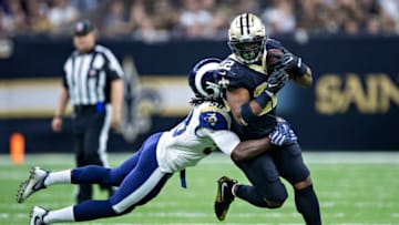 NEW ORLEANS, LA - NOVEMBER 4: Cory Littleton #58 of the Los Angeles Rams tackles Mark Ingram II #22 of the New Orleans Saints at Mercedes-Benz Superdome on November 4, 2018 in New Orleans, Louisiana. The Saints defeated the Rams 45-35. (Photo by Wesley Hitt/Getty Images)