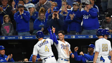 KANSAS CITY, MISSOURI - MAY 10: Alex Gordon #4 of the Kansas City Royals celebrates with Whit Merrifield #15 after hitting a home run in the fifth inning against the Philadelphia Phillies at Kauffman Stadium on May 10, 2019 in Kansas City, Missouri. It was Gordon's 1500th career hit. (Photo by Ed Zurga/Getty Images)