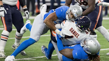 DETROIT, MI - NOVEMBER 22: Quarterback Chase Daniel #4 of the Chicago Bears gets sacked by Romeo Okwara #95 and Damon Harrison #98 of the Detroit Lions during an NFL game at Ford Field on November 22, 2018 in Detroit, Michigan. (Photo by Dave Reginek/Getty Images)