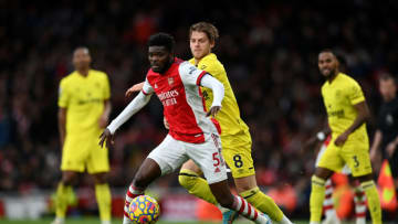 LONDON, ENGLAND - FEBRUARY 19: Thomas Partey of Arsenal is put under pressure by Mathias Jensen of Brentford during the Premier League match between Arsenal and Brentford at Emirates Stadium on February 19, 2022 in London, England. (Photo by Shaun Botterill/Getty Images)