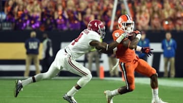 Jan 11, 2016; Glendale, AZ, USA; Clemson Tigers wide receiver Artavis Scott (3) is tackled by Alabama Crimson Tide defensive back Eddie Jackson (4) in the 2016 CFP National Championship at University of Phoenix Stadium. Mandatory Credit: Matt Kartozian-USA TODAY Sports