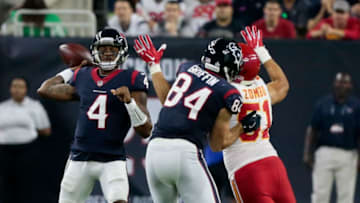 HOUSTON, TX - OCTOBER 08: Deshaun Watson #4 of the Houston Texans throws a pass as he gets a block from Ryan Griffin #84 on Frank Zombo #51 of the Kansas City Chiefs at NRG Stadium on October 8, 2017 in Houston, Texas. (Photo by Bob Levey/Getty Images)