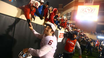 Nov 28, 2015; Stillwater, OK, USA; Oklahoma Sooners quarterback Baker Mayfield (6) celebrates with fans following the game against the Oklahoma State Cowboys at Boone Pickens Stadium. The Sooners defeated the Cowboys 58-23. Mandatory Credit: Mark J. Rebilas-USA TODAY Sports