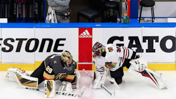 Malcolm Subban #30 of the Chicago Blackhawks and Marc-Andre Fleury #29 of the Vegas Golden Knights stretch prior to their Game Five of the Western Conference First Round.