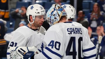 BUFFALO, NY - MARCH 20: John Tavares #91 and Garret Sparks #40 of the Toronto Maple Leafs celebrate a win against the Buffalo Sabres following an NHL game on March 20, 2019 at KeyBank Center in Buffalo, New York. Toronto won, 4-2. (Photo by Bill Wippert/NHLI via Getty Images)
