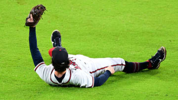 ATLANTA, GEORGIA - OCTOBER 12: Dansby Swanson #7 of the Atlanta Braves catches an out against the Philadelphia Phillies during the sixth inning in game two of the National League Division Series at Truist Park on October 12, 2022 in Atlanta, Georgia. (Photo by Adam Hagy/Getty Images)