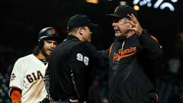 SAN FRANCISCO, CA - MAY 17: Bruce Bochy #15 of the San Francisco Giants and Brandon Crawford #35 argue with umpire Chris Segal #96 after a called third strike during the twelfth inning against the Colorado Rockies at AT&T Park on May 17, 2018 in San Francisco, California. The Colorado Rockies defeated the San Francisco Giants 5-3 in 12 innings. (Photo by Jason O. Watson/Getty Images)