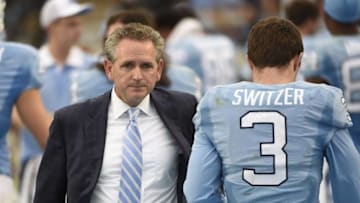 Nov 7, 2015; Chapel Hill, NC, USA; North Carolina Tar Heels athletic director Bubba Cunningham with wide receiver Ryan Switzer (3) on the sidelines in the fourth quarter. The Tar Heels defeated the Blue Devils 66-31 at Kenan Memorial Stadium. Mandatory Credit: Bob Donnan-USA TODAY Sports