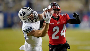 Oct 31, 2020; Provo, UT, USA; BYU wide receiver Gunner Romney (left) catches a pass against Western Kentucky defensive back Roger Cray (24) in the first half of an NCAA college football game Saturday, Oct. 31, 2020, in Provo, Utah. Mandatory Credit: Rick Bowmer/Pool Photo-USA TODAY Sports