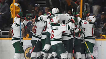 Dec 27, 2016; Nashville, TN, USA; Minnesota Wild players celebrate after a win in overtime against the Nashville Predators at Bridgestone Arena. Minnesota won 3-2 in overtime. Mandatory Credit: Christopher Hanewinckel-USA TODAY Sports