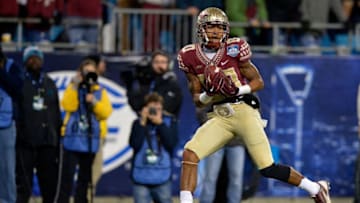 CHARLOTTE, NC - DECEMBER 06: Rashad Greene #80 of the Florida State Seminoles catches a touchdown pass against the Georgia Tech Yellow Jackets during the Atlantic Coast Conference championship game on December 6, 2014 in Greenville, North Carolina. (Photo by Grant Halverson/Getty Images)