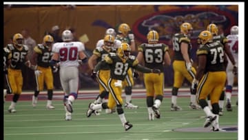 26 Jan 1997: Wide receiver Desmond Howard of the Green Bay Packers (center) moves down the field during Super Bowl XXXI against the New England Patriots at the Superdome in New Orleans, Louisiana. The Packers won the game, 35-21. Mandatory Credit: Brian