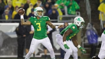 Nov 7, 2015; Eugene, OR, USA; Oregon Ducks quarterback Vernon Adams Jr. (3) throws the ball as Ducks running back Royce Freeman (21) defends against the California Golden Bears at Autzen Stadium. Mandatory Credit: Scott Olmos-USA TODAY Sports