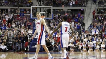 Apr 5, 2014; Auburn Hills, MI, USA; Detroit Pistons forward Kyle Singler (25) and guard Brandon Jennings (7) celebrate during the fourth quarter against the Boston Celtics at The Palace of Auburn Hills. Pistons beat the Celtics 115-111. Mandatory Credit: Raj Mehta-USA TODAY Sports