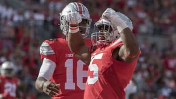 Sep 12, 2015; Columbus, OH, USA;*Ohio State Buckeyes running back Ezekiel Elliott (15) and teammate Ohio State Buckeyes quarterback J.T. Barrett (16) celebrate his touchdown in the second quarter of the game against the Hawaii Warriors at Ohio Stadium. Mandatory Credit: Trevor Ruszkowski-USA TODAY Sports