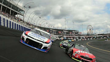 CHARLOTTE, NC - SEPTEMBER 30: Kurt Busch, driver of the #41 Haas Automation/Monster Energy Ford, and AJ Allmendinger, driver of the #47 Kroger ClickList Chevrolet, lead the field at the start of the Monster Energy NASCAR Cup Series Bank of America Roval 400 at Charlotte Motor Speedway on September 30, 2018 in Charlotte, North Carolina. (Photo by Chris Graythen/Getty Images)