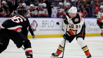 Jan 21, 2023; Buffalo, New York, USA; Anaheim Ducks center Isac Lundestrom (21) looks to make a pass as Buffalo Sabres defenseman Ilya Lyubushkin (46) defends during the third period at KeyBank Center. Mandatory Credit: Timothy T. Ludwig-USA TODAY Sports