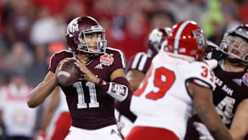 JACKSONVILLE, FL - DECEMBER 31: Kellen Mond #11 of the Texas A&M Aggies looks to pass against the North Carolina State Wolfpack in the first half of the TaxSlayer Gator Bowl at TIAA Bank Field on December 31, 2018 in Jacksonville, Florida. (Photo by Joe Robbins/Getty Images)