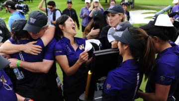 PORTLAND, OR - MAY 25: Members of the Washington Huskies golf team celebrate with the trophy after winning the 2016 NCAA Division I Women's Golf Championship against Stanford at Eugene Country Club on May 25, 2016 in Eugene, Oregon. (Photo by Steve Dykes/Getty Images)