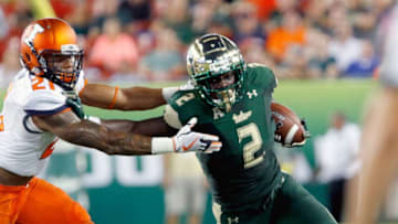 TAMPA, FL - SEPTEMBER 15: Running back D'Ernest Johnson #2 of the South Florida Bulls fights off DUPLICATE***defensive back Patrick Nelson #21 of the Illinois Fighting Illini during the first quarter at Raymond James Stadium on September 15, 2017 in Tampa, Florida. (Photo by Joseph Garnett Jr. /Getty Images)