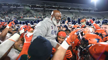 EAST LANSING, MI - NOVEMBER 09: Members of Illinois football team pick coach Lovie Smith up on their shoulders following a college football game between the Michigan State Spartans and Illinois Fighting Illini on November 9, 2019 at Spartan Stadium in East Lansing, MI. (Photo by Adam Ruff/Icon Sportswire via Getty Images)