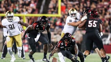 Louisville's Hassan Hall scrambles to recover a Cardinal fumble in the second half as the Cards fell to Notre Dame 35-17. Sept. 2, 2019.Louisville Vs Notre Dame 2019 Football
