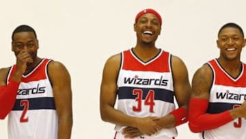 Sep 29, 2014; Washington, DC, USA; Washington Wizards guard John Wall (2), Wizards forward Paul Pierce (34), and Wizards guard Bradley Beal (3) laugh during Wizards Media Day at Verizon Center. Mandatory Credit: Geoff Burke-USA TODAY Sports