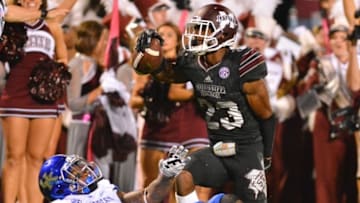 Oct 24, 2015; Starkville, MS, USA; Mississippi State Bulldogs defensive back Taveze Calhoun (23) celebrates after intercepting the pass intended for Kentucky Wildcats wide receiver Dorian Baker (2) during the game at Davis Wade Stadium. Mississippi State won 42-16. Mandatory Credit: Matt Bush-USA TODAY Sports