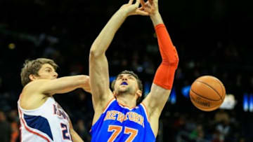 Nov 13, 2013; Atlanta, GA, USA; Atlanta Hawks shooting guard Kyle Korver (26) slaps the ball away from New York Knicks power forward Andrea Bargnani (77) in the first quarter at Philips Arena. Mandatory Credit: Daniel Shirey-USA TODAY Sports