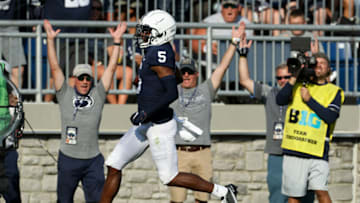 Sep 11, 2021; University Park, Pennsylvania, USA; Penn State Nittany Lions wide receiver Jahan Dotson (5) runs the ball into the end zone for a touchdown during the second quarter against the Ball State Cardinals at Beaver Stadium. Mandatory Credit: Matthew OHaren-USA TODAY Sports