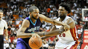 Oct 4, 2015; Miami, FL, USA; Charlotte Hornets guard Aaron Harrison (9) is pressured by Miami Heat forward Justise Winslow (20) during the first half at American Airlines Arena. Mandatory Credit: Steve Mitchell-USA TODAY Sports