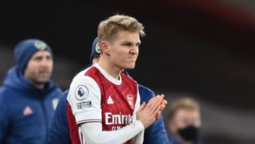 Arsenal's Norwegian midfielder Martin Odegaard prepares to come on as a substitute during the English Premier League football match between Arsenal and Manchester United at the Emirates Stadium in London on January 30, 2021. (Photo by Shaun Botterill / POOL / AFP) / RESTRICTED TO EDITORIAL USE. No use with unauthorized audio, video, data, fixture lists, club/league logos or 'live' services. Online in-match use limited to 120 images. An additional 40 images may be used in extra time. No video emulation. Social media in-match use limited to 120 images. An additional 40 images may be used in extra time. No use in betting publications, games or single club/league/player publications. / (Photo by SHAUN BOTTERILL/POOL/AFP via Getty Images)