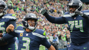 SEATTLE, WA - OCTOBER 07: Quarterback Russell Wilson #3 of the Seattle Seahawks celebrates a touchdown in the second half against the Los Angeles Rams at CenturyLink Field on October 7, 2018 in Seattle, Washington. (Photo by Otto Greule Jr/Getty Images)