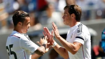 Jul 26, 2014; Berkeley, CA, USA; Real Madrid middle fielder Gareth Bale (11) is congratulated by Real Madrid teammate after Bale scored during the first half against Inter Milan in the first round of the Guinness International Champions Cup at California Memorial Stadium. Mandatory Credit: Bob Stanton-USA TODAY Sports